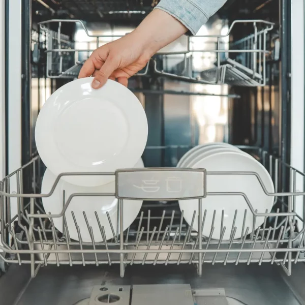 female-hand-loading-dished-empty-out-unloading-dishwasher-with-utensils-kitchen-appliances-lifestyle-view-woman-puts-plate-dishwasher-takes-from-it-housewife-does-her-housework