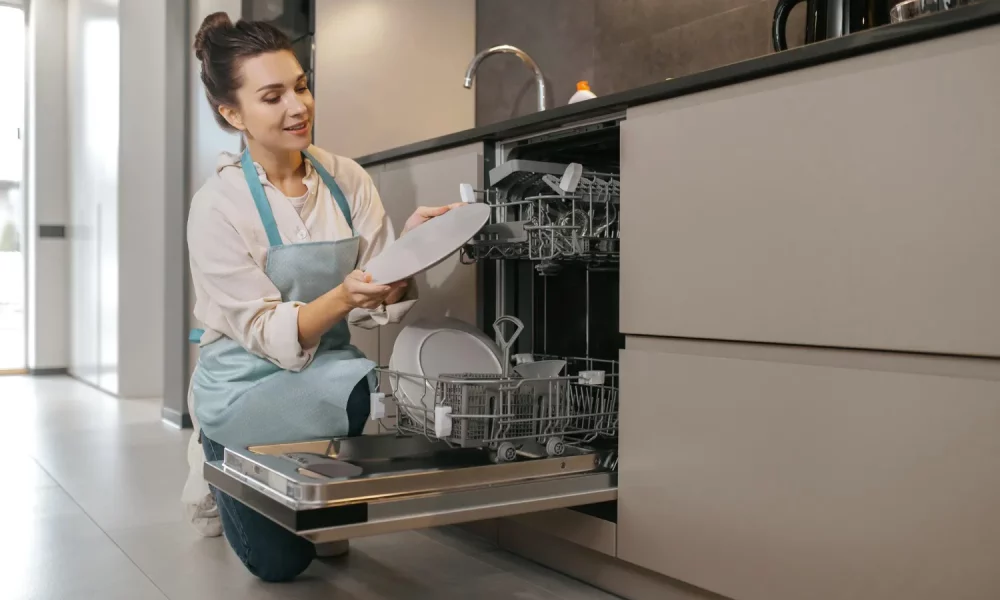 young-woman-apron-cleaning-crockery